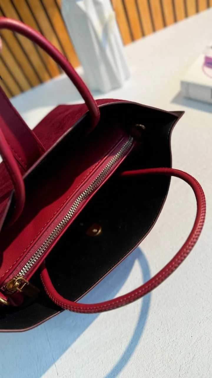 Elegant Suede Handbag with Faux Leather Accents and Detachable Strap